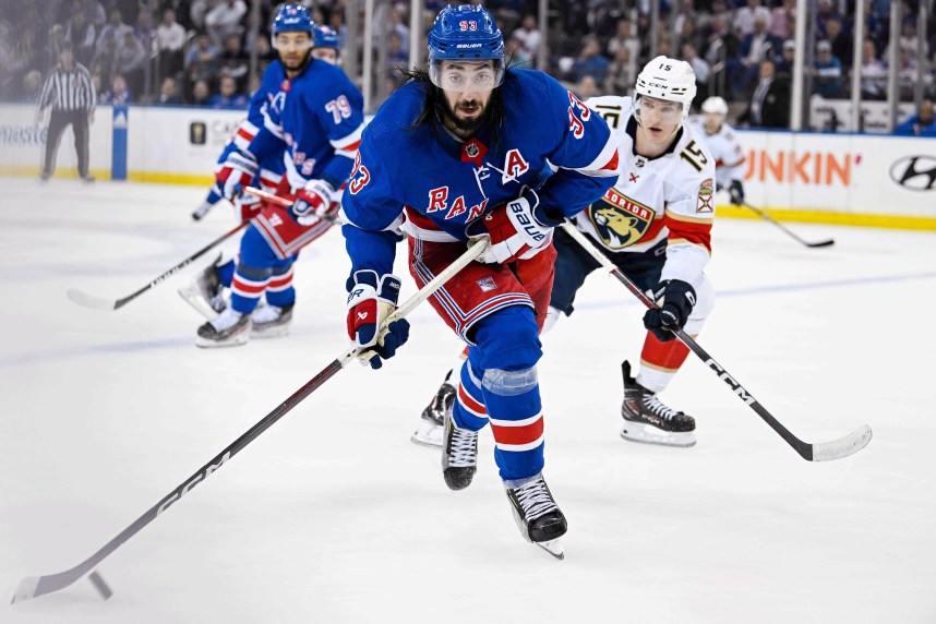 May 30, 2024; New York, New York, USA; New York Rangers center Mika Zibanejad (93) skates with the puck against the Florida Panthers during the third period in game five of the Eastern Conference Final of the 2024 Stanley Cup Playoffs at Madison Square Garden. Mandatory Credit: Dennis Schneidler-USA TODAY Sports