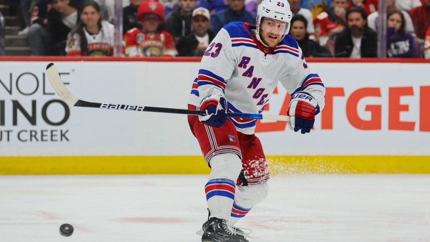 May 28, 2024; Sunrise, Florida, USA; New York Rangers defenseman Adam Fox (23) shoots the puck against the Florida Panthers during the third period in game four of the Eastern Conference Final of the 2024 Stanley Cup Playoffs at Amerant Bank Arena. Mandatory Credit: Sam Navarro-USA TODAY Sports