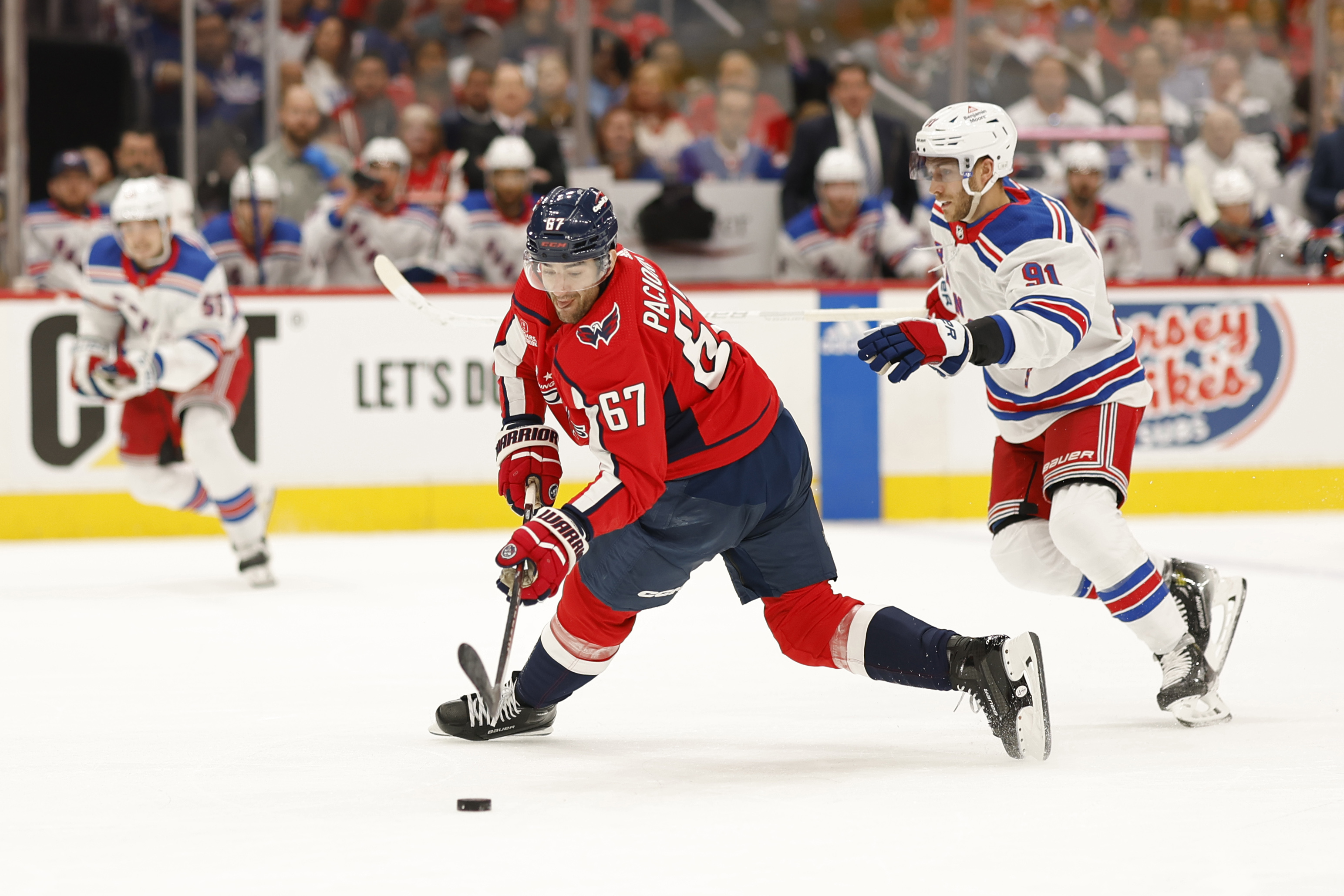 Apr 26, 2024; Washington, District of Columbia, USA; Washington Capitals left wing Max Pacioretty (67) shoots the puck as New York Rangers center Alex Wennberg (91) defends in the first period.in game three of the first round of the 2024 Stanley Cup Playoffs at Capital One Arena. Mandatory Credit: Geoff Burke-USA TODAY Sports