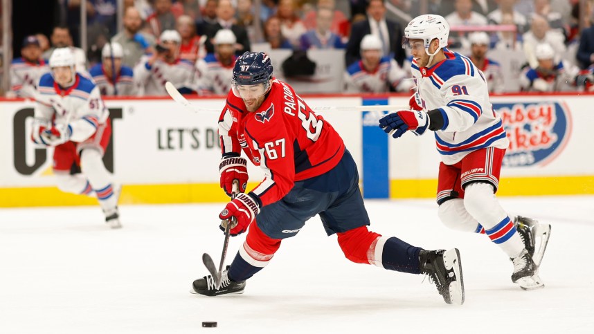 Apr 26, 2024; Washington, District of Columbia, USA; Washington Capitals left wing Max Pacioretty (67) shoots the puck as New York Rangers center Alex Wennberg (91) defends in the first period.in game three of the first round of the 2024 Stanley Cup Playoffs at Capital One Arena. Mandatory Credit: Geoff Burke-USA TODAY Sports