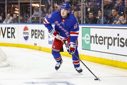 Apr 21, 2024; New York, New York, USA; New York Rangers defenseman Ryan Lindgren (55) controls the puck in the third period against the Washington Capitals in game one of the first round of the 2024 Stanley Cup Playoffs at Madison Square Garden. Mandatory Credit: Wendell Cruz-USA TODAY Sports