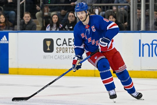 Apr 23, 2024; New York, New York, USA;  New York Rangers defenseman Jacob Trouba (8) skates with the puck against the Washington Capitals during the first period in game two of the first round of the 2024 Stanley Cup Playoffs at Madison Square Garden. Mandatory Credit: Dennis Schneidler-USA TODAY Sports