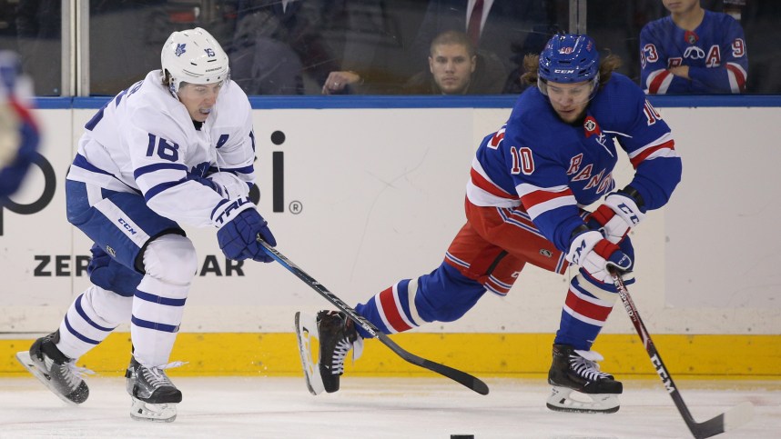 Dec 20, 2019; New York, NY, USA; Toronto Maple Leafs center Mitch Marner (16) steals the puck away from New York Rangers left wing Artemi Panarin (10) during the third period at Madison Square Garden. Mandatory Credit: Brad Penner-USA TODAY Sports