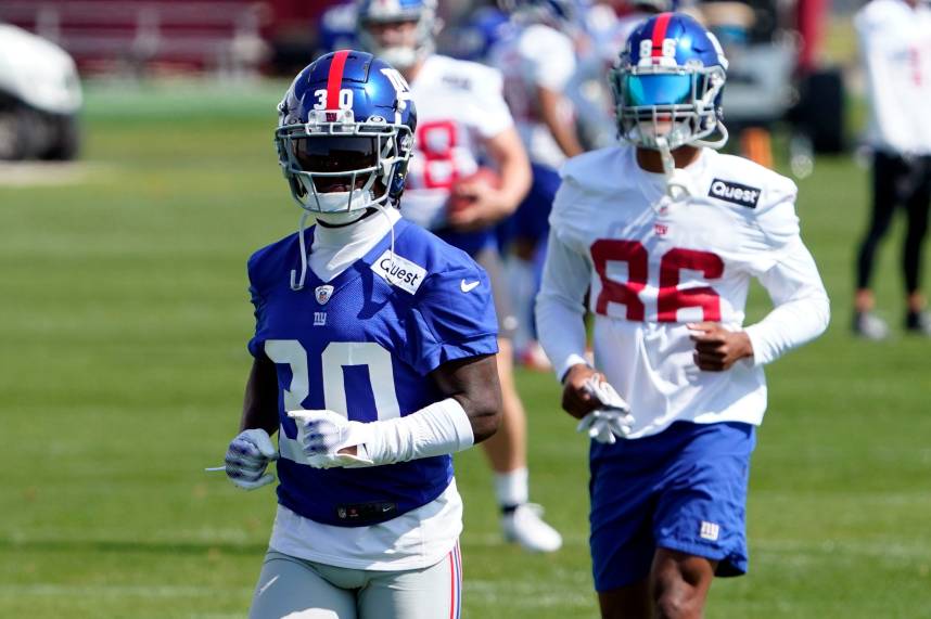 New York Giants cornerback Darnay Holmes (30) and wide receiver Darius Slayton (86) participate in organized team activities (OTA's) at the Giants training center on Wednesday, May 31, 2023, in East Rutherford.