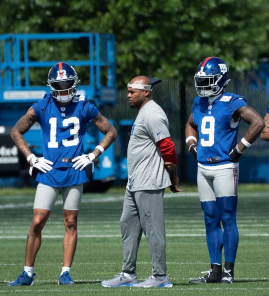Steve Smith, center, is a two-time former All-Pro NFL wide receiver assisting with the NY Giants this spring. Here he works with Jalin Hyatt (13) and rookie Malik Nabers (9) in East Rutherford, NJ on Thursday May 30, 2024.
