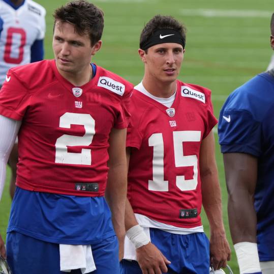 East Rutherford, NJ -- June 11, 2024 -- Quarterbacks,Drew Lock and Tommy DeVito walk off at the end of practice field at the NY Giants Mandatory Minicamp at their practice facility in East Rutherford, NJ.