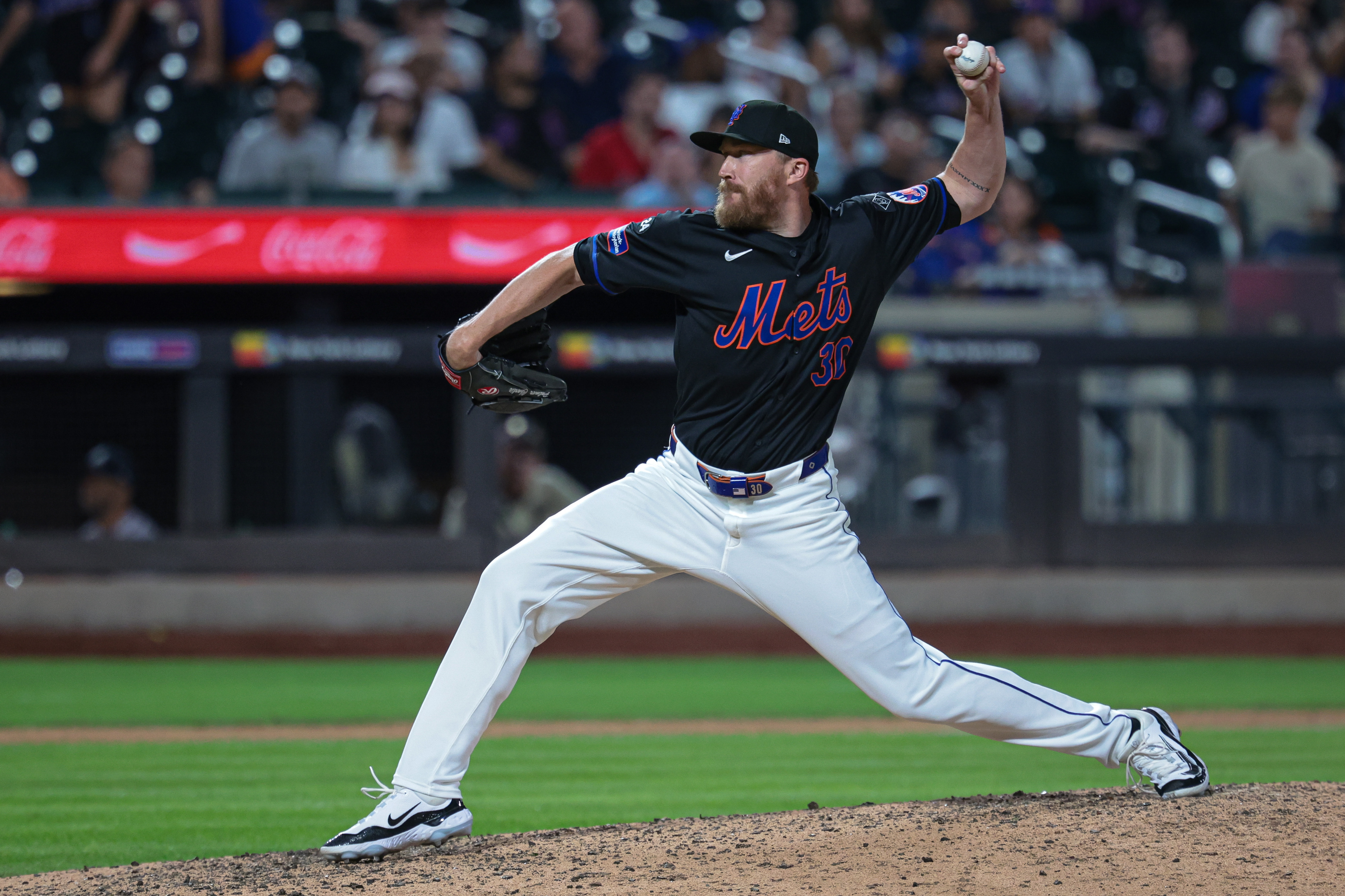 Jul 26, 2024; New York City, New York, USA;  New York Mets relief pitcher Jake Diekman (30) delivers a pitch during the ninth inning against the Atlanta Braves at Citi Field. Mandatory Credit: Vincent Carchietta-USA TODAY Sports