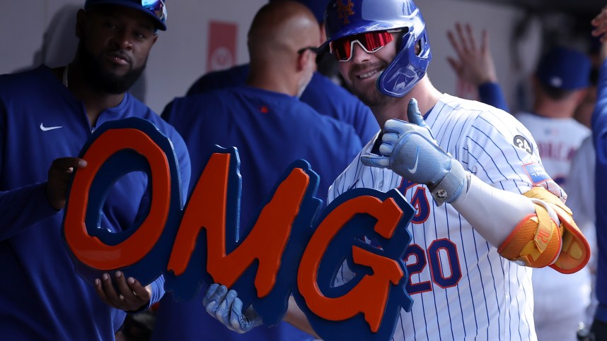 Jul 28, 2024; New York City, New York, USA; New York Mets first baseman Pete Alonso (20) celebrates his two run home run against the Atlanta Braves in the dugout during the eighth inning at Citi Field. Mandatory Credit: Brad Penner-USA TODAY Sports