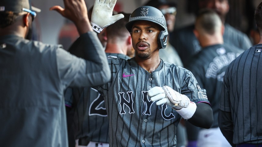 Jul 13, 2024; New York City, New York, USA; New York Mets shortstop Francisco Lindor (12) is greeted in the dugout after hitting a three run home run in the eighth inning against the Colorado Rockies at Citi Field. Mandatory Credit: Wendell Cruz-USA TODAY Sports