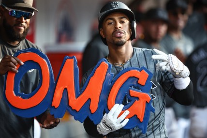Jul 13, 2024; New York City, New York, USA; New York Mets shortstop Francisco Lindor (12) celebrates in the dugout after hitting a three run home run in the eighth inning against the Colorado Rockies at Citi Field. Mandatory Credit: Wendell Cruz-USA TODAY Sports