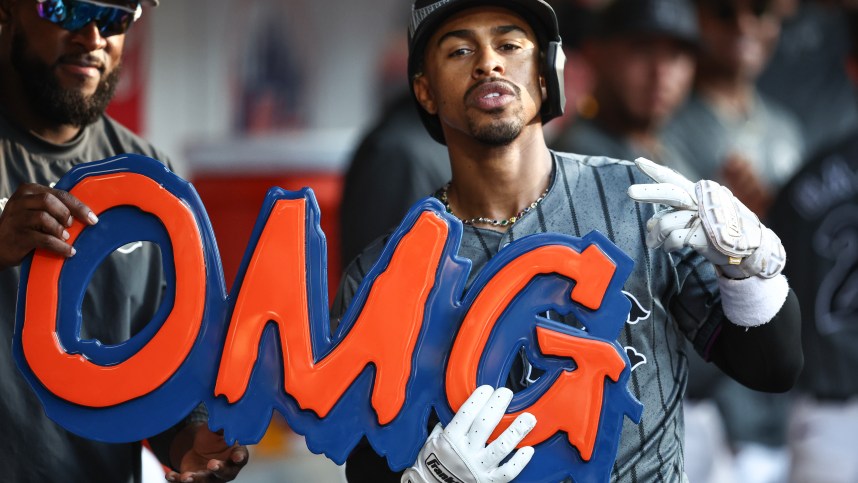 Jul 13, 2024; New York City, New York, USA; New York Mets shortstop Francisco Lindor (12) celebrates in the dugout after hitting a three run home run in the eighth inning against the Colorado Rockies at Citi Field. Mandatory Credit: Wendell Cruz-USA TODAY Sports