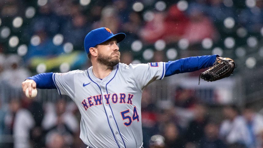 Apr 9, 2024; Cumberland, Georgia, USA; New York Mets pitcher Cole Susler (54) pitches against Atlanta Braves during the eighth inning at Truist Park. Mandatory Credit: Jordan Godfree-USA TODAY Sports