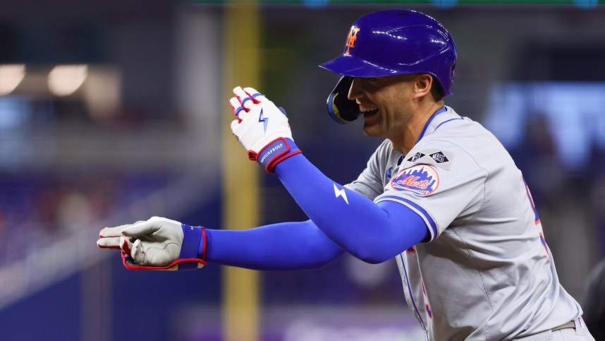 Jul 19, 2024; Miami, Florida, USA; New York Mets left fielder Brandon Nimmo (9) reacts from first base after hitting a single against the Miami Marlins during the third inning at loanDepot Park. Mandatory Credit: Sam Navarro-USA TODAY Sports