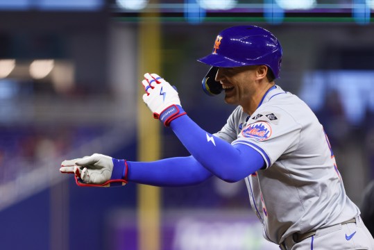 Jul 19, 2024; Miami, Florida, USA; New York Mets left fielder Brandon Nimmo (9) reacts from first base after hitting a single against the Miami Marlins during the third inning at loanDepot Park. Mandatory Credit: Sam Navarro-USA TODAY Sports