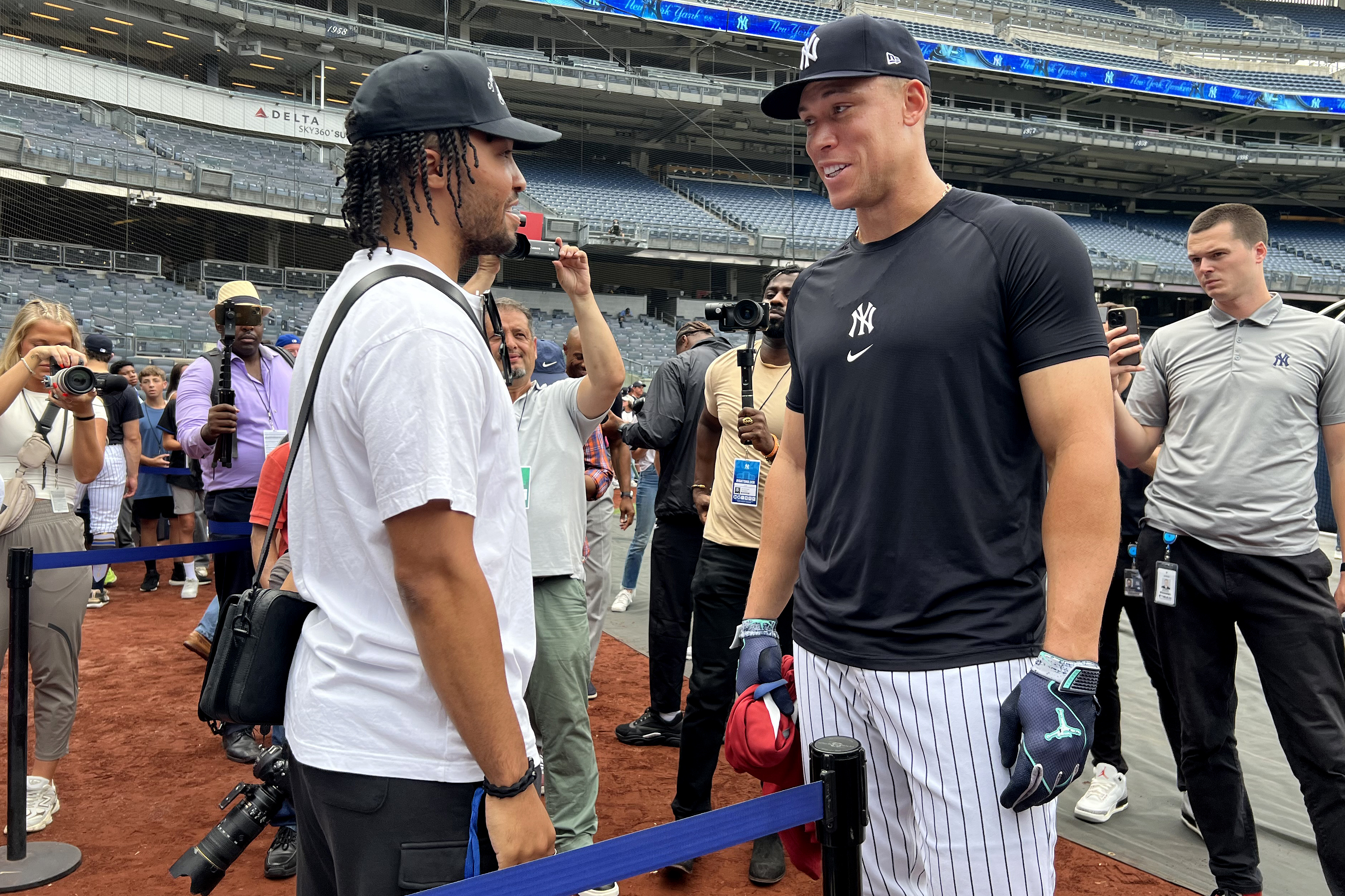 Jul 24, 2024; Bronx, New York, USA; New York Yankees center fielder Aaron Judge (99) talks to New York Knicks guard Jalen Brunson before a game against the New York Mets at Yankee Stadium. Mandatory Credit: Brad Penner-USA TODAY Sports