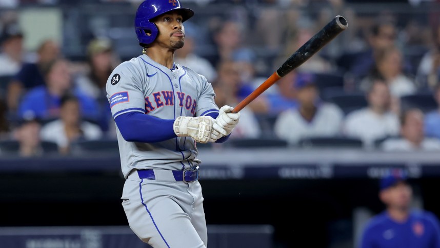 Jul 24, 2024; Bronx, New York, USA; New York Mets shortstop Francisco Lindor (12) watches his two run home run against the New York Yankees during the fifth inning at Yankee Stadium. Mandatory Credit: Brad Penner-USA TODAY Sports