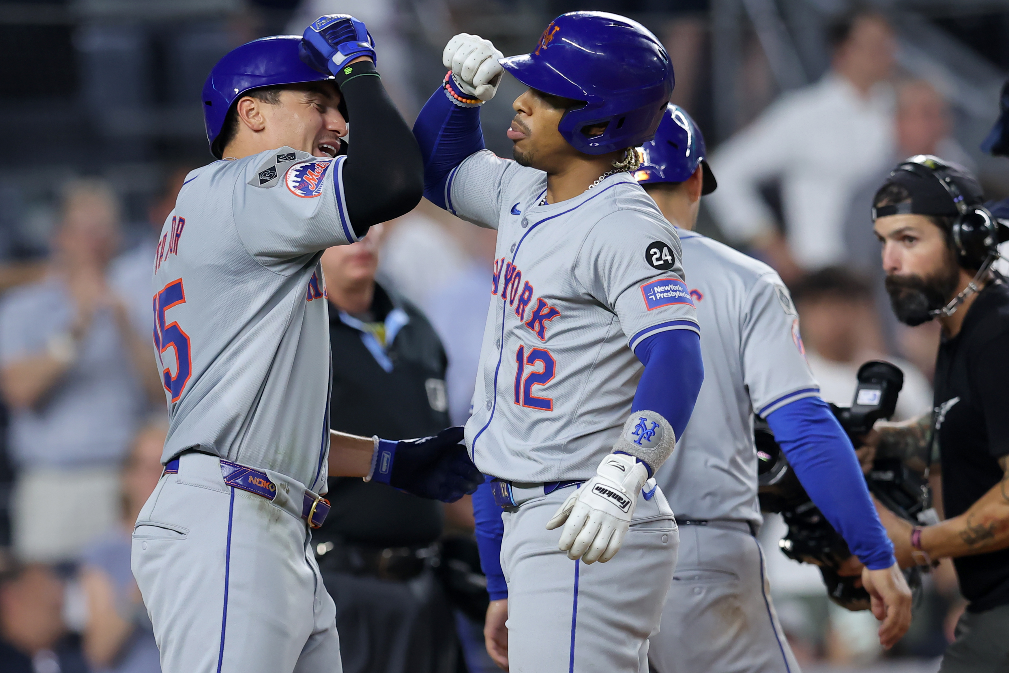 Jul 24, 2024; Bronx, New York, USA; New York Mets shortstop Francisco Lindor (12) celebrates his three run home run against the New York Yankees with center fielder Tyrone Taylor (15) during the eighth inning at Yankee Stadium. Mandatory Credit: Brad Penner-USA TODAY Sports