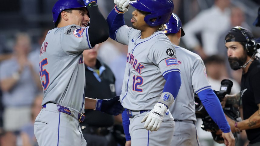 Jul 24, 2024; Bronx, New York, USA; New York Mets shortstop Francisco Lindor (12) celebrates his three run home run against the New York Yankees with center fielder Tyrone Taylor (15) during the eighth inning at Yankee Stadium. Mandatory Credit: Brad Penner-USA TODAY Sports