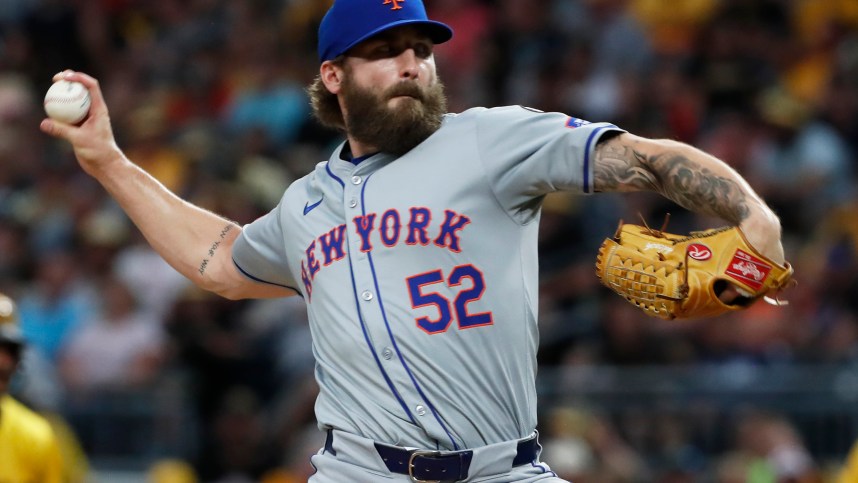 Jul 5, 2024; Pittsburgh, Pennsylvania, USA;  New York Mets pitcher Ty Adcock (52) pitches against the Pittsburgh Pirates during the seventh inning at PNC Park. Mandatory Credit: Charles LeClaire-USA TODAY Sports