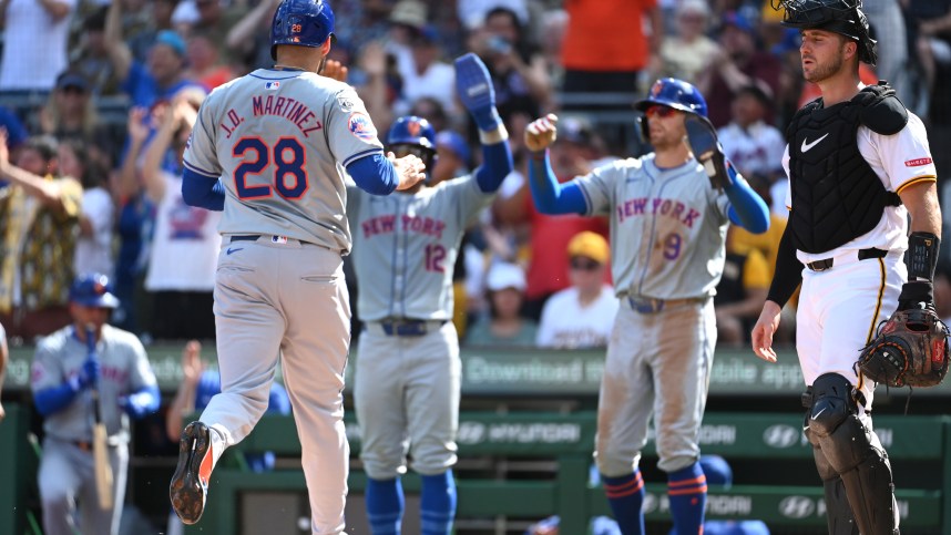 Jul 6, 2024; Pittsburgh, Pennsylvania, USA;  New York Mets base runner J.D. Martinez (28) scores by Pittsburgh Pirates catcher Joey Bart (14) befote being greeted by Francisco Lindor (12) and Brandon Nimmo (9) during the third inning at PNC Park. Mandatory Credit: Philip G. Pavely-USA TODAY Sports