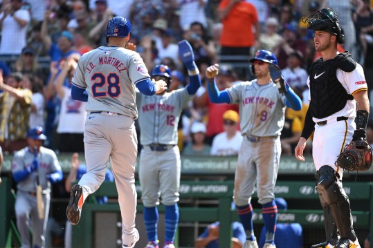 Jul 6, 2024; Pittsburgh, Pennsylvania, USA;  New York Mets base runner J.D. Martinez (28) scores by Pittsburgh Pirates catcher Joey Bart (14) befote being greeted by Francisco Lindor (12) and Brandon Nimmo (9) during the third inning at PNC Park. Mandatory Credit: Philip G. Pavely-USA TODAY Sports