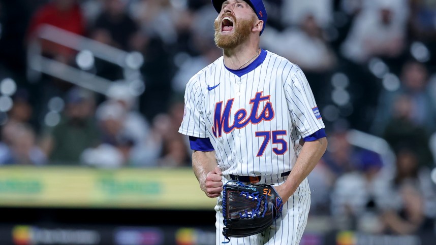 Jun 25, 2024; New York City, New York, USA; New York Mets relief pitcher Reed Garrett (75) reacts after getting the final out against the New York Yankees at Citi Field. Mandatory Credit: Brad Penner-USA TODAY Sports