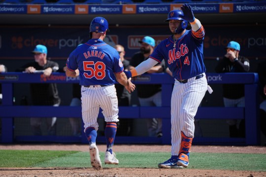 Feb 27, 2024; Port St. Lucie, Florida, USA; New York Mets second baseman Rylan Bannon (58) is greeted by Francisco Alvarez (4) after scoring a run against the Miami Marlins in the third inning at Clover Park. Mandatory Credit: Jim Rassol-USA TODAY Sports