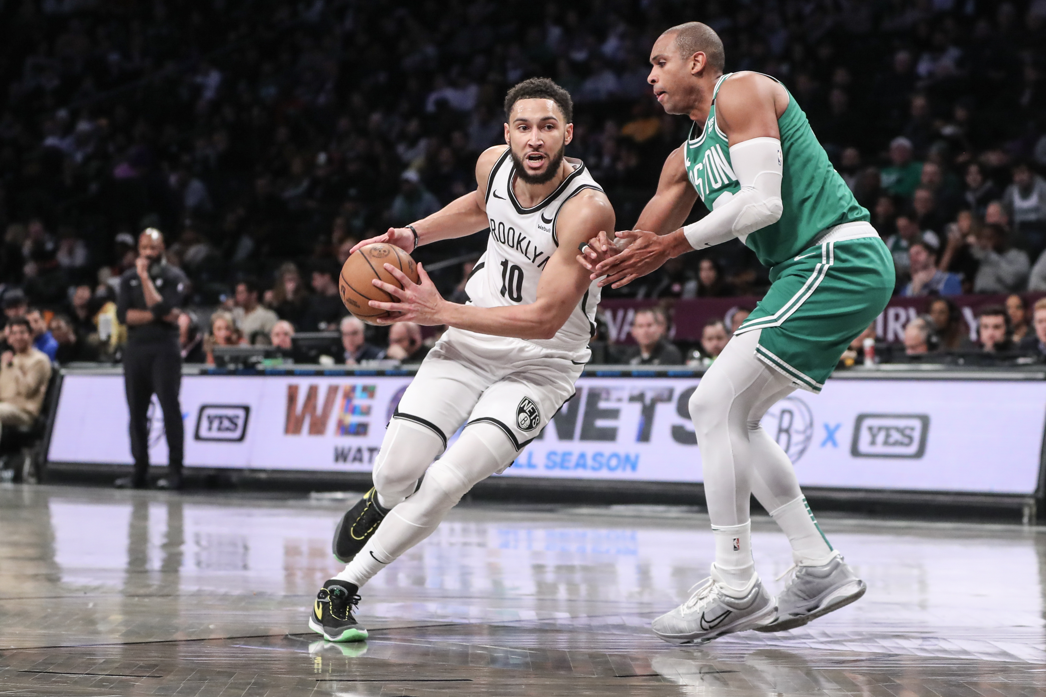 Feb 13, 2024; Brooklyn, New York, USA;  Brooklyn Nets guard Ben Simmons (10) drives past Boston Celtics center Al Horford (42) in the third quarter at Barclays Center. Mandatory Credit: Wendell Cruz-USA TODAY Sports