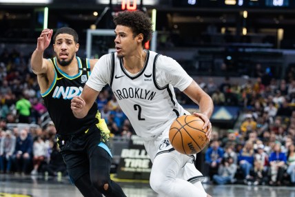 Mar 16, 2024; Indianapolis, Indiana, USA; Brooklyn Nets forward Cameron Johnson (2) dribbles the ball while Indiana Pacers guard Tyrese Haliburton (0) defends in the second half at Gainbridge Fieldhouse. Mandatory Credit: Trevor Ruszkowski-USA TODAY Sports