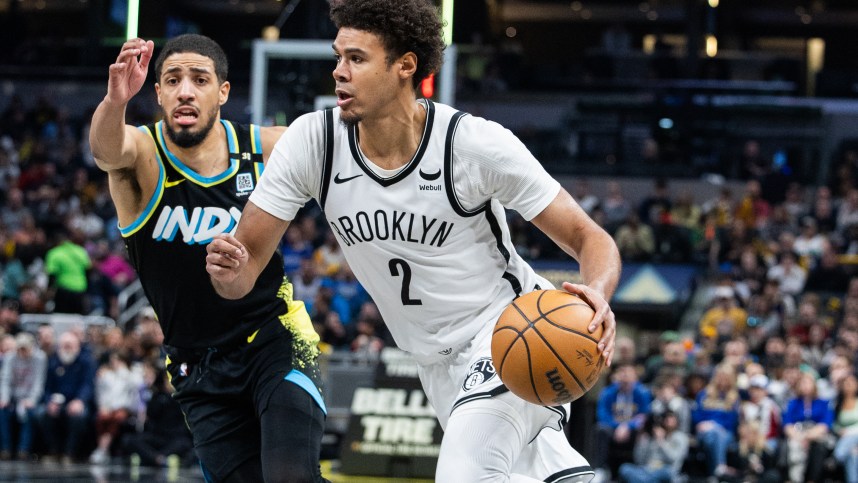 Mar 16, 2024; Indianapolis, Indiana, USA; Brooklyn Nets forward Cameron Johnson (2) dribbles the ball while Indiana Pacers guard Tyrese Haliburton (0) defends in the second half at Gainbridge Fieldhouse. Mandatory Credit: Trevor Ruszkowski-USA TODAY Sports