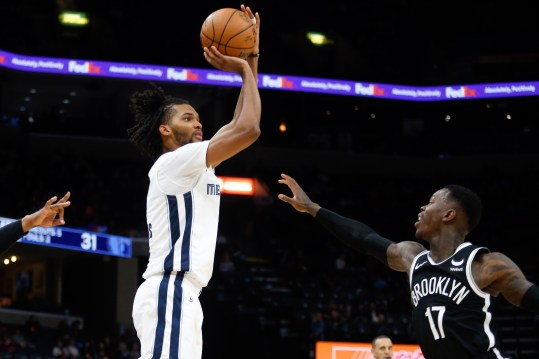 Feb 26, 2024; Memphis, Tennessee, USA; Memphis Grizzlies forward Ziaire Williams (8) shoots from the three point line as Brooklyn Nets guard Dennis Schroder (17) defends during the first half at FedExForum. Mandatory Credit: Petre Thomas-USA TODAY Sports