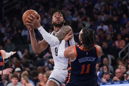 Apr 12, 2024; New York, New York, USA; New York Knicks guard Jalen Brunson (11) draws a charge on Brooklyn Nets forward Trendon Watford (9) during the first quarter at Madison Square Garden. Mandatory Credit: Vincent Carchietta-USA TODAY Sports