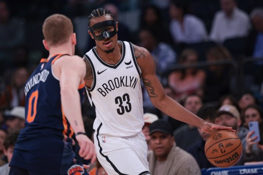 Apr 12, 2024; New York, New York, USA; Brooklyn Nets center Nic Claxton (33) dribbles against New York Knicks guard Donte DiVincenzo (0) during the first quarter at Madison Square Garden. Mandatory Credit: Vincent Carchietta-USA TODAY Sports