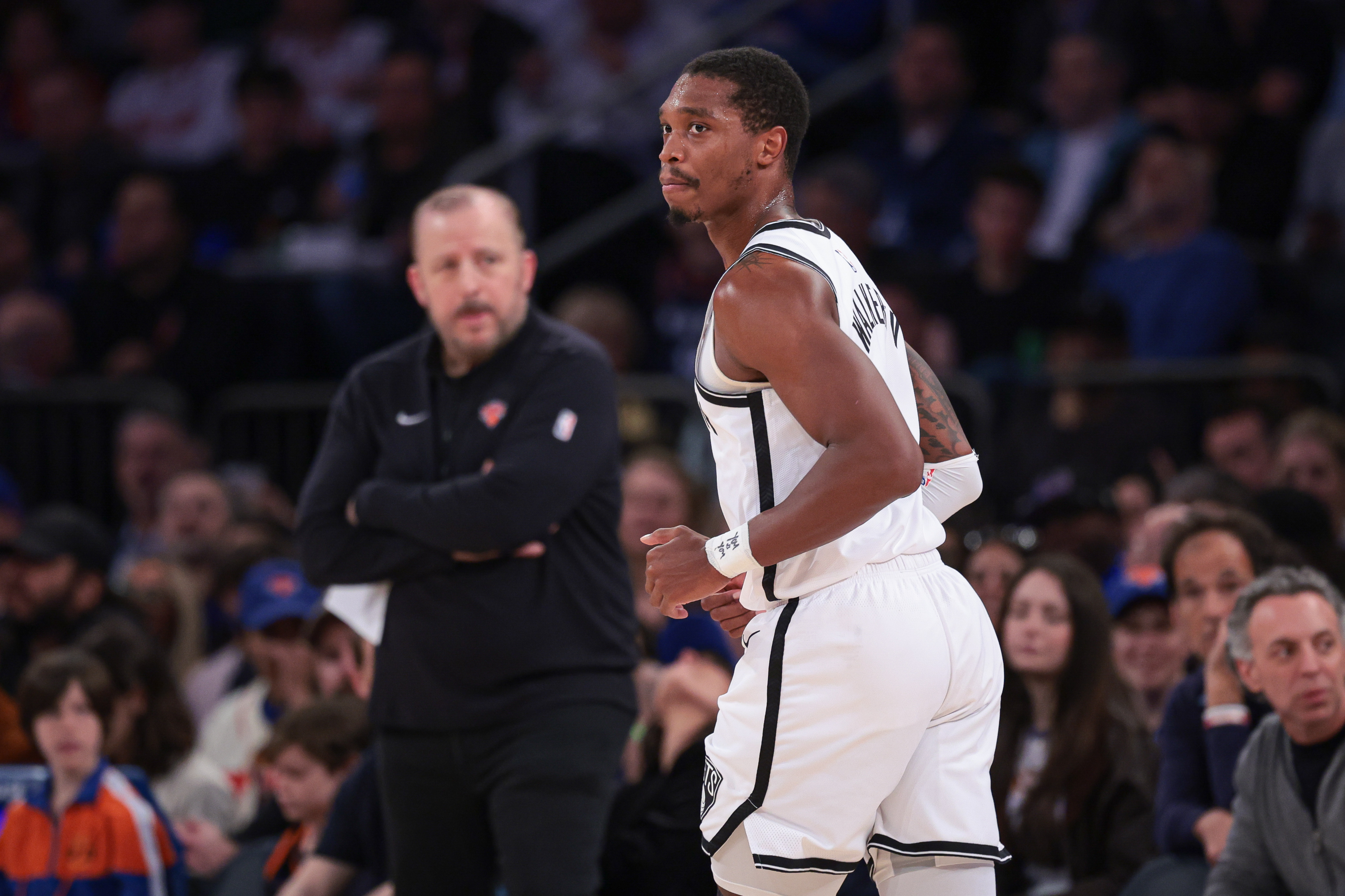 Apr 12, 2024; New York, New York, USA; Brooklyn Nets guard Lonnie Walker IV (8) runs up court after a basket in front of New York Knicks head coach Tom Thibodeau during the first half at Madison Square Garden. Mandatory Credit: Vincent Carchietta-USA TODAY Sports