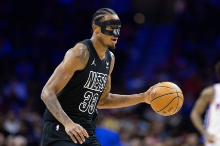 Apr 14, 2024; Philadelphia, Pennsylvania, USA; Brooklyn Nets center Nic Claxton (33) dribbles the ball against the Philadelphia 76ers during the first quarter at Wells Fargo Center. Mandatory Credit: Bill Streicher-USA TODAY Sports