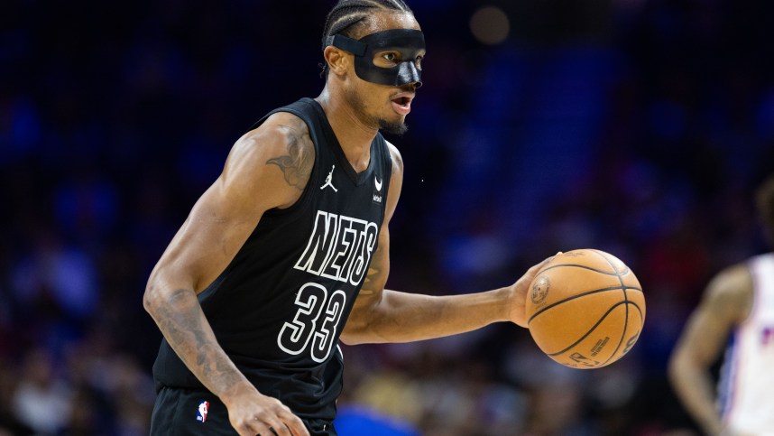 Apr 14, 2024; Philadelphia, Pennsylvania, USA; Brooklyn Nets center Nic Claxton (33) dribbles the ball against the Philadelphia 76ers during the first quarter at Wells Fargo Center. Mandatory Credit: Bill Streicher-USA TODAY Sports