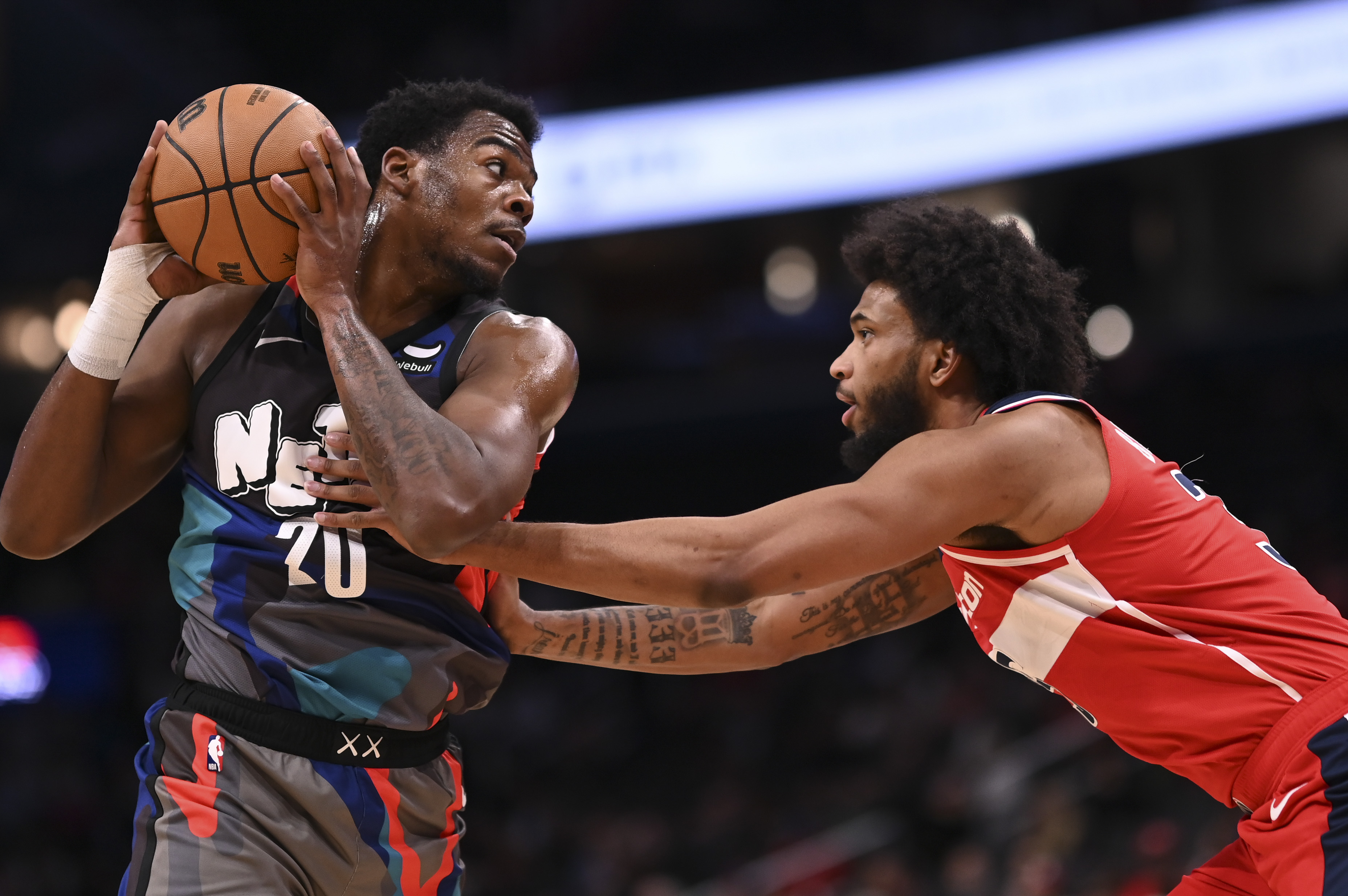 Mar 27, 2024; Washington, District of Columbia, USA;  Brooklyn Nets center Day'Ron Sharpe (20) looks to pass as Washington Wizards forward Marvin Bagley III (35) defends during the first half at Capital One Arena. Mandatory Credit: Tommy Gilligan-USA TODAY Sports