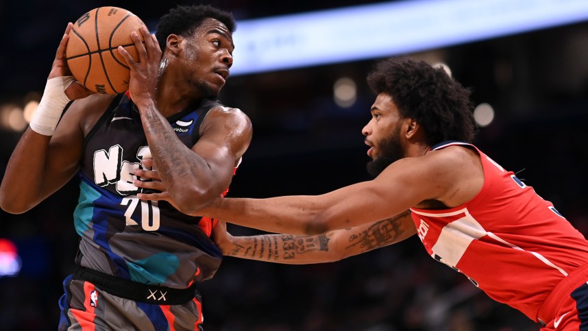 Mar 27, 2024; Washington, District of Columbia, USA;  Brooklyn Nets center Day'Ron Sharpe (20) looks to pass as Washington Wizards forward Marvin Bagley III (35) defends during the first half at Capital One Arena. Mandatory Credit: Tommy Gilligan-USA TODAY Sports