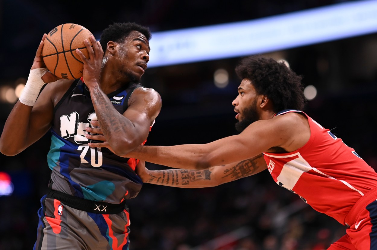 Mar 27, 2024; Washington, District of Columbia, USA;  Brooklyn Nets center Day'Ron Sharpe (20) looks to pass as Washington Wizards forward Marvin Bagley III (35) defends during the first half at Capital One Arena. Mandatory Credit: Tommy Gilligan-USA TODAY Sports