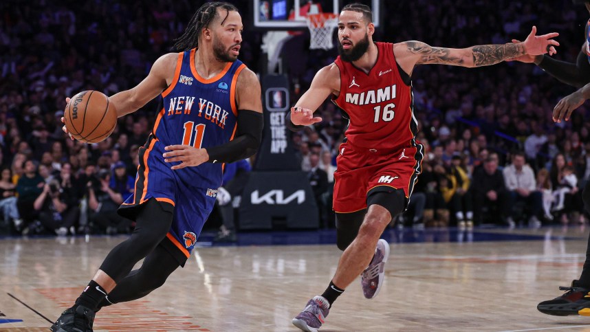 Jan 27, 2024; New York, New York, USA; New York Knicks guard Jalen Brunson (11) dribbles against Miami Heat forward Caleb Martin (16) during the second half at Madison Square Garden. Mandatory Credit: Vincent Carchietta-USA TODAY Sports