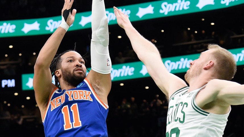 Apr 11, 2024; Boston, Massachusetts, USA;  New York Knicks guard Jalen Brunson (11) shoots the ball past Boston Celtics forward Sam Hauser (30) during the first half at TD Garden. Mandatory Credit: Bob DeChiara-USA TODAY Sports