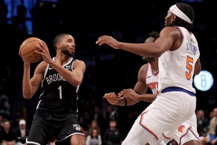 Jan 23, 2024; Brooklyn, New York, USA; Brooklyn Nets forward Mikal Bridges (1) looks to pass the ball against New York Knicks forwards OG Anunoby (8) and Precious Achiuwa (5) during the fourth quarter at Barclays Center. Mandatory Credit: Brad Penner-USA TODAY Sports