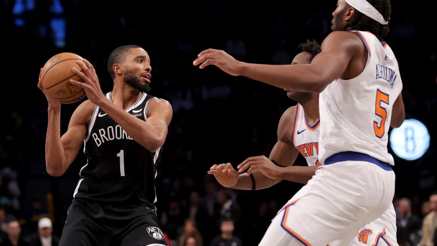 January 23, 2024; Brooklyn, New York, USA; Brooklyn Nets forward Mikal Bridges (1) attempts to pass the ball against New York Knicks forwards OG Anunoby (8) and Precious Achiuwa (5) during the fourth quarter at Barclays Center. Mandatory Photo Credit: Brad Penner-USA TODAY Sports