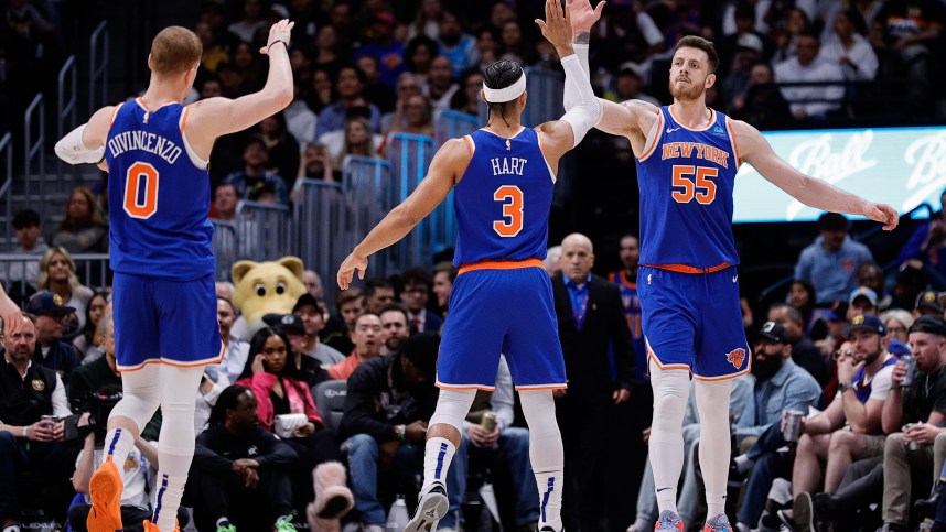 Mar 21, 2024; Denver, Colorado, USA; New York Knicks center Isaiah Hartenstein (55) reacts with guard Josh Hart (3) and guard Donte DiVincenzo (0) in the second quarter against the Denver Nuggets at Ball Arena. Mandatory Credit: Isaiah J. Downing-USA TODAY Sports