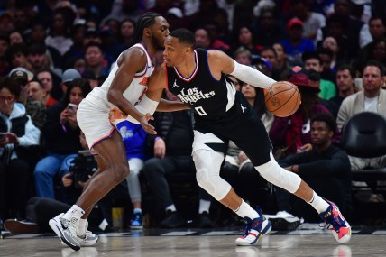 Dec 16, 2023; Los Angeles, California, USA; Los Angeles Clippers guard Russell Westbrook (0) moves the ball against New York Knicks guard Immanuel Quickley (5) during the second half at Crypto.com Arena. Mandatory Credit: Gary A. Vasquez-USA TODAY Sports