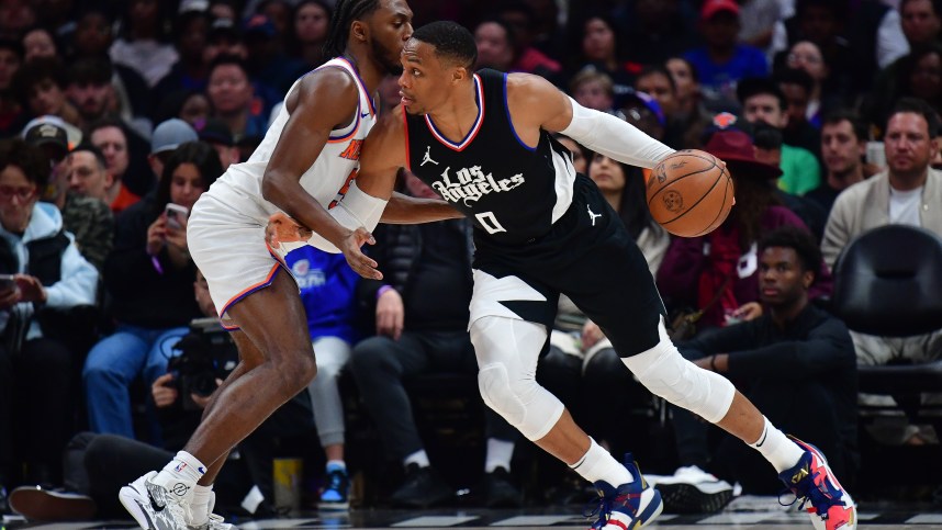 Dec 16, 2023; Los Angeles, California, USA; Los Angeles Clippers guard Russell Westbrook (0) moves the ball against New York Knicks guard Immanuel Quickley (5) during the second half at Crypto.com Arena. Mandatory Credit: Gary A. Vasquez-USA TODAY Sports