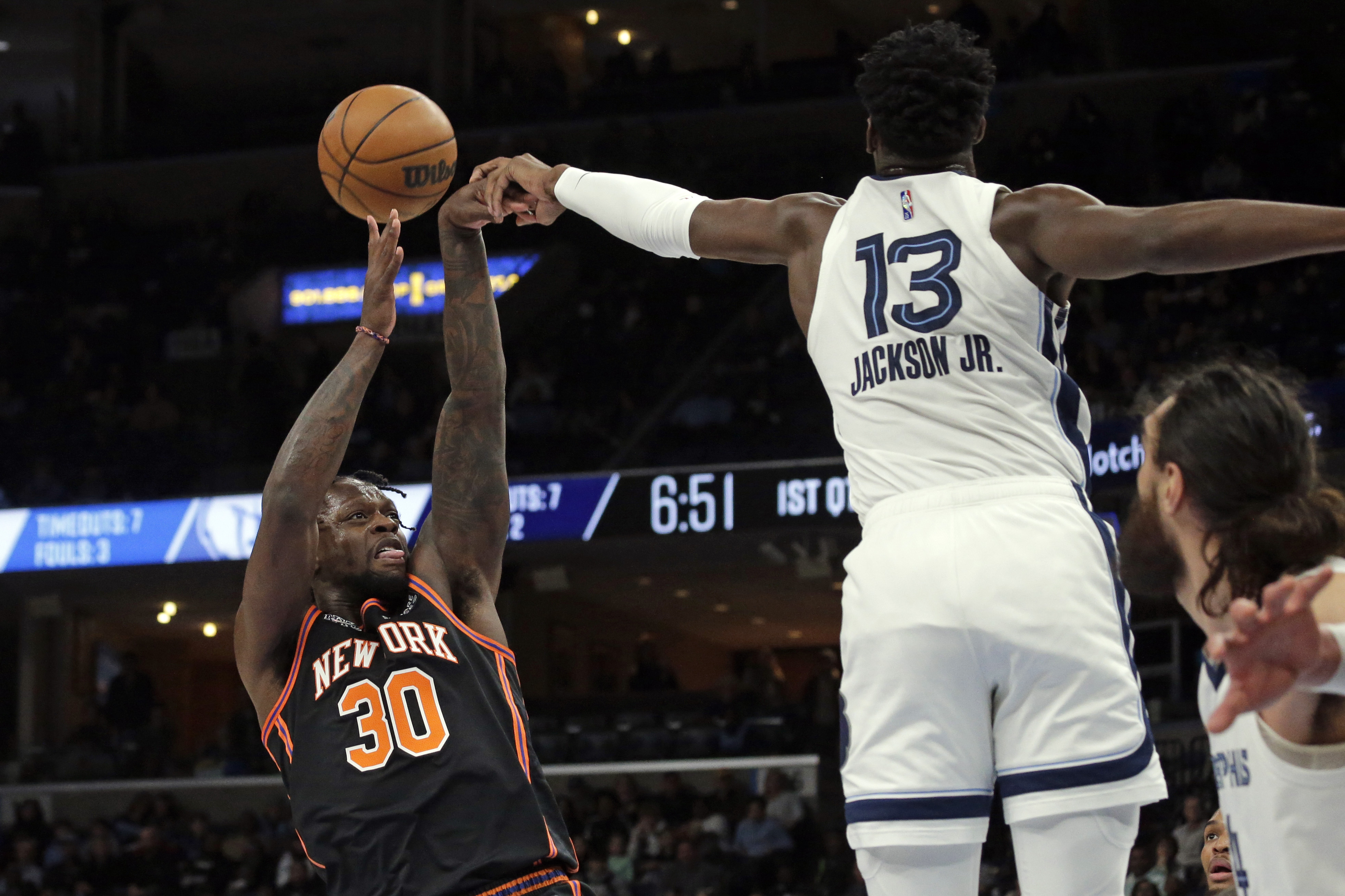 Mar 11, 2022; Memphis, Tennessee, USA; New York Knicks forward Julius Randle (30) shoots as Memphis Grizzlies forward Jaren Jackson Jr. (13) blocks his shot during the first half at FedExForum. Mandatory Credit: Petre Thomas-USA TODAY Sports