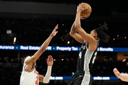 Mar 29, 2024; San Antonio, Texas, USA; San Antonio Spurs guard Devin Vassell (24) shoots over New York Knicks guard Miles McBride (2) during the first half at Frost Bank Center. Mandatory Credit: Scott Wachter-USA TODAY Sports