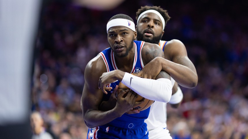 May 2, 2024; Philadelphia, Pennsylvania, USA; New York Knicks center Mitchell Robinson (23) and Philadelphia 76ers forward Paul Reed (44) wrestle for the ball during the second half of game six of the first round for the 2024 NBA playoffs at Wells Fargo Center. Mandatory Credit: Bill Streicher-USA TODAY Sports