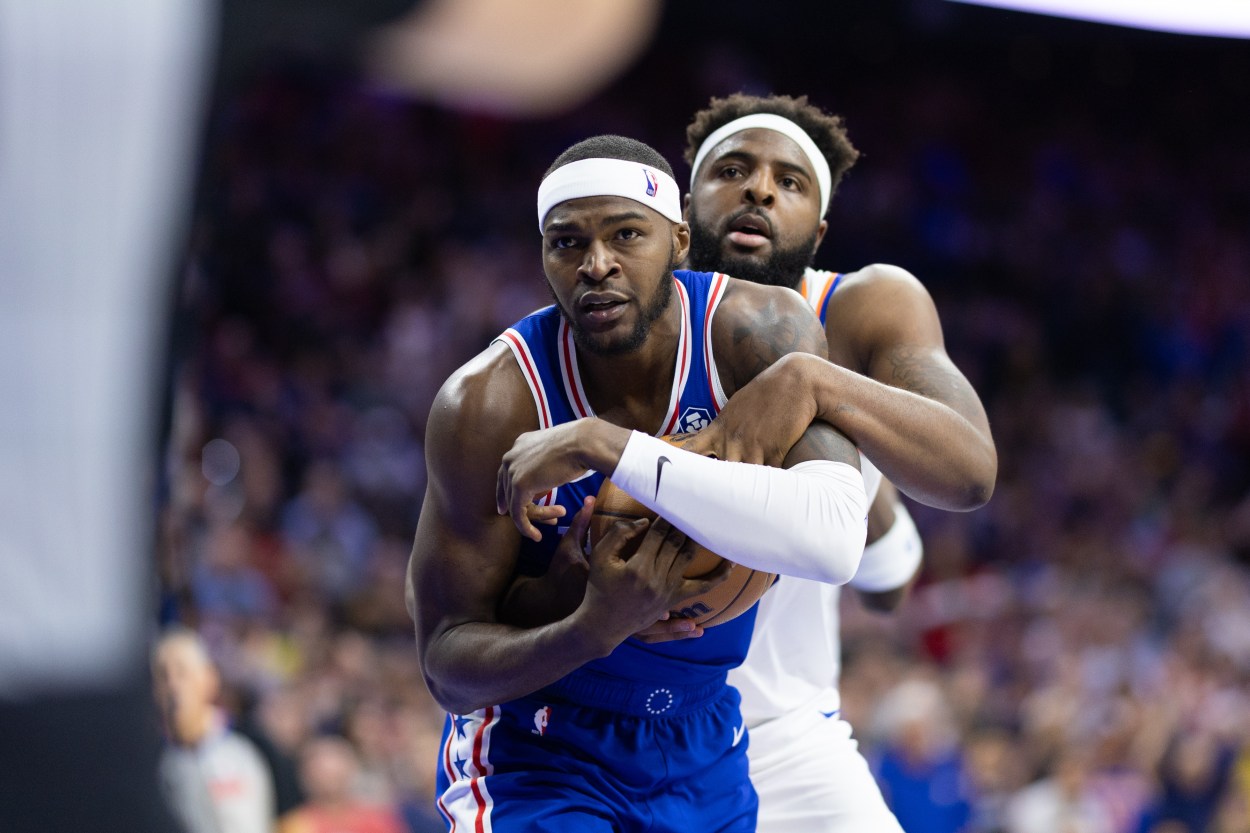 May 2, 2024; Philadelphia, Pennsylvania, USA; New York Knicks center Mitchell Robinson (23) and Philadelphia 76ers forward Paul Reed (44) wrestle for the ball during the second half of game six of the first round for the 2024 NBA playoffs at Wells Fargo Center. Mandatory Credit: Bill Streicher-USA TODAY Sports